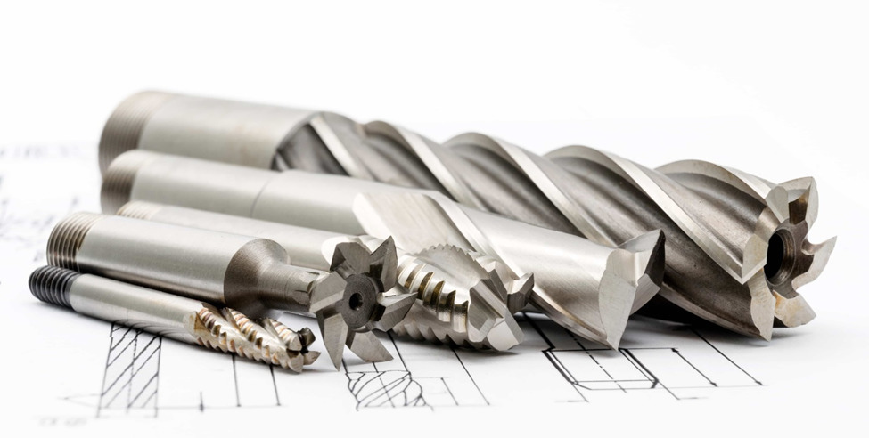 Examples of tooling for milling machine operations, including cutters, drills, and broaching bits.